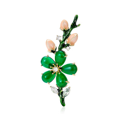 green crystal blossom branch brooch shown in the main product arrangement