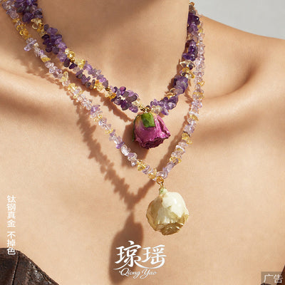 Layered purple crystal chip necklaces with white and magenta resin rose pendants