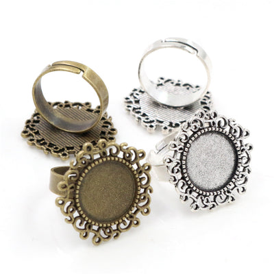 Ornate Oval Ring Bezel Settings in Two Antique Finishes assortment on a plain background