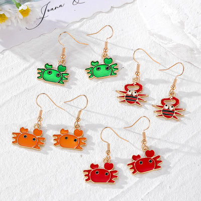 Four pairs of enamel crab drop earrings in green orange red and funny red styles