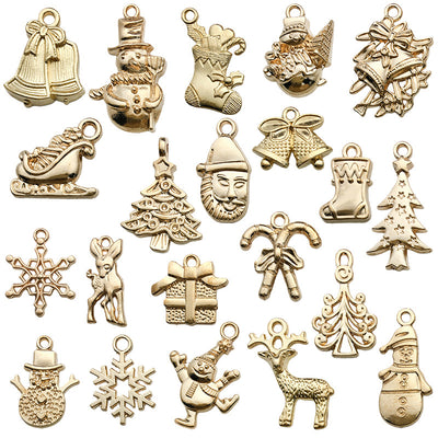 Gold-tone assorted shape charms arranged on a light background