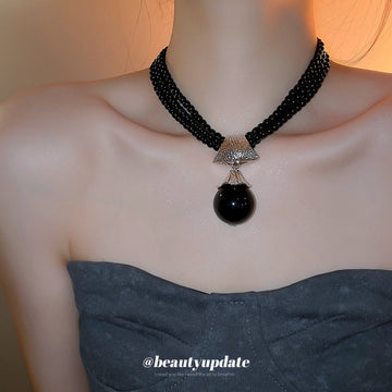 Black Multi Strand Beaded Necklace with Round Pendant