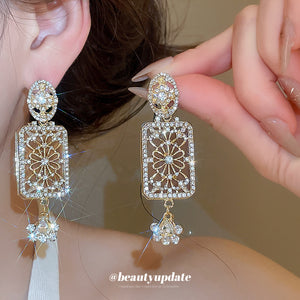 Gold Tone Crystal Rectangle Drop Earrings With Polished Metal Details