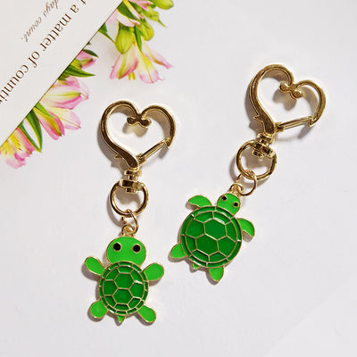 Main product view of green Turtle Charms with Gold Tone Heart Clasps in Two Designs