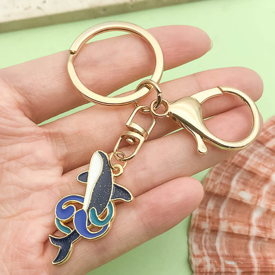 Image 1 showing a person holding up a keychain.