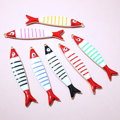 Grouped front view of colorful striped enamel fish charms in eight color options
