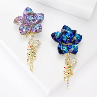 Front view of the faceted rose brooch and its color options