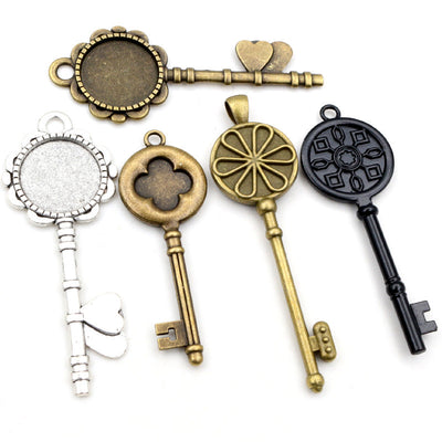 Image 1 showing key-shaped pendant bezel settings in ten ornate designs in the pictured colors and forms