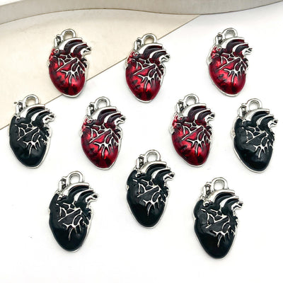Colorful assorted shape charms arranged on a light background