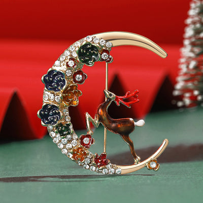 Floral Crescent Moon Reindeer Brooch shown against a white display background