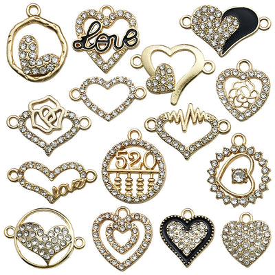 Gold-tone heart and alphabet letter charms arranged on a light background