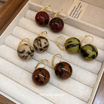Gold Tone Hoop And Stud Earrings With Marbled Resin Ball Drops