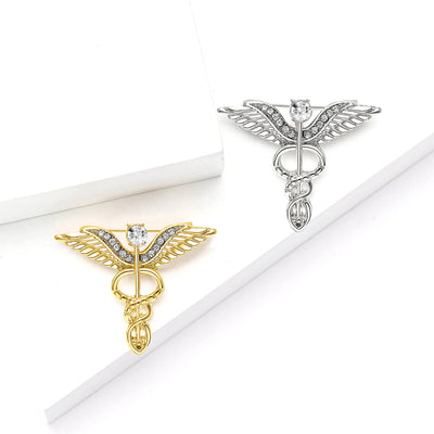 winged staff emblem brooch shown in the main product arrangement