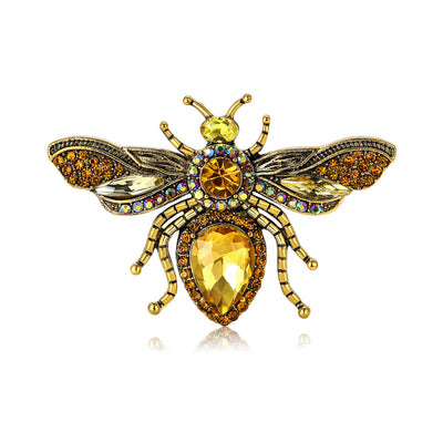 Front view of winged bee set with colored stones and a large faceted body crystal