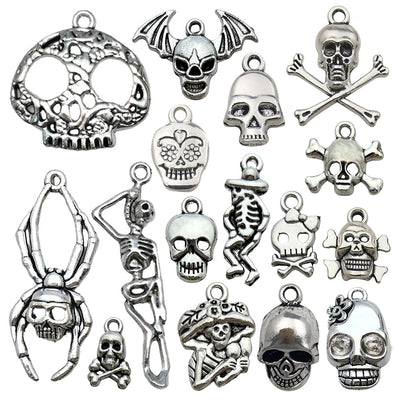 Metallic assorted shape charms arranged on a light background