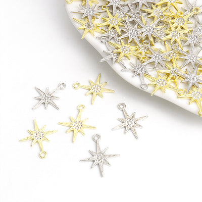 Assorted star charms arranged on a white surface