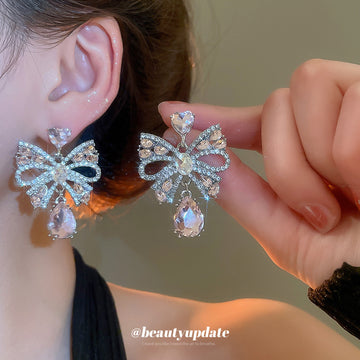Silver Tone Crystal Bow Stud Earrings With Pink Teardrop Accents