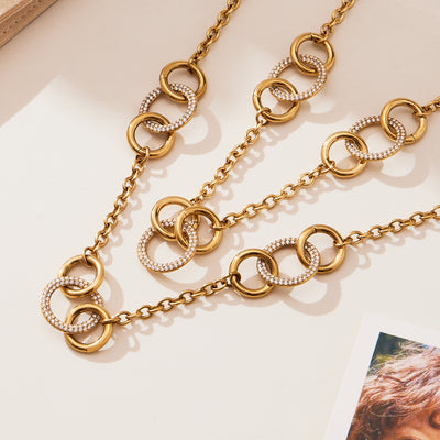Close-up of gold interlocked zircon circle chain links