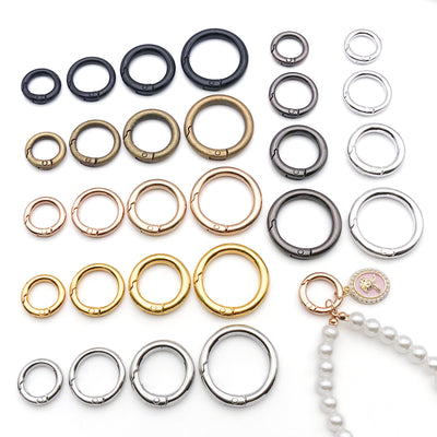Metallic assorted shape jewelry findings arranged on a light background