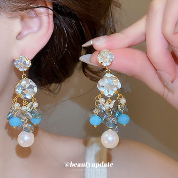 Blue Crystal Floral Drop Earrings in Polished Statement Design