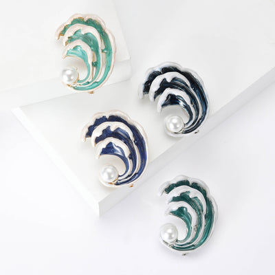 Product display showing layered curling enamel waves surrounding a white pearl