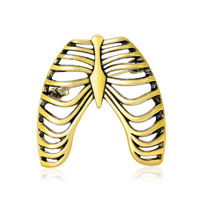 Gold rib cage brooch front on white