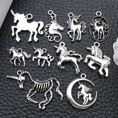 Antique silver assorted shape charms arranged on a light background
