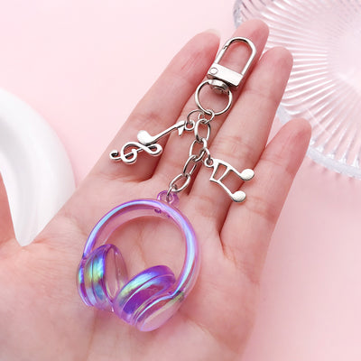 Image 1 showing a hand holding a pair of scissors and a ring.