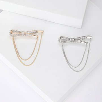 Crystal Bow Chain Brooch In Gold Or Silver Tone With Polished Metal Detail