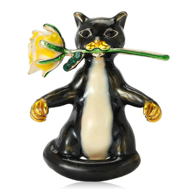 Front view of the enamel cat holding a yellow rose brooch decorative clothing pin on a white background