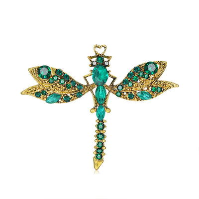 Front product view of the dragonfly brooch pin in gold and green