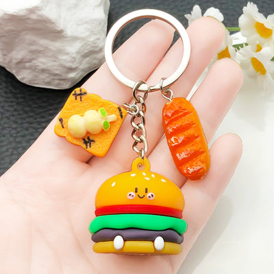 Overview showing the available color and design variations of the colorful burger frankfurter and pizza keychain