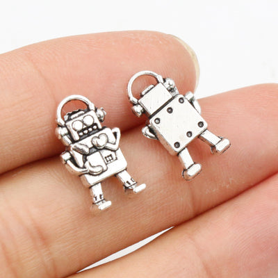 small articulated robot charm arranged together on a white background
