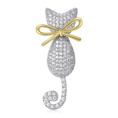 Front view of crystal-covered cat silhouette brooch with gold tone bow against a white background.