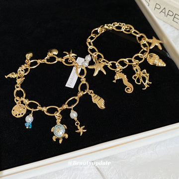 Seven Ocean Charm Bracelets With Starfish Shell Turtle And Whale Tail Details