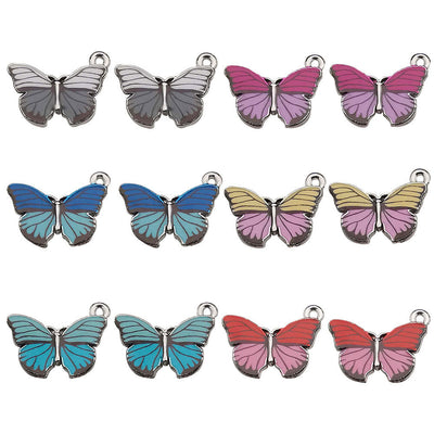 Colorful butterfly charms arranged on a light background