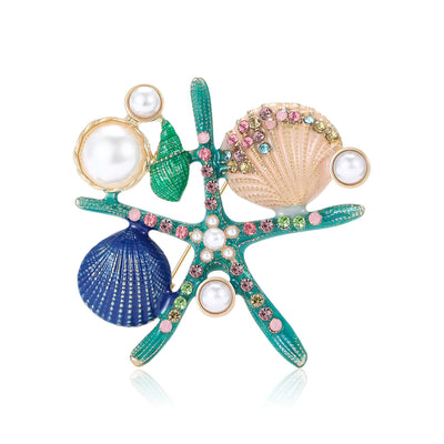 Front view of the enamel starfish and seashell brooch with pearls decorative clothing pin on a white background
