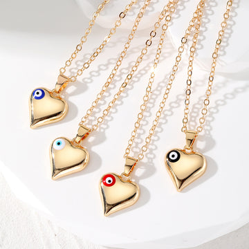 Gold Tone Puffy Heart Pendant Necklaces with Evil Eye Accents