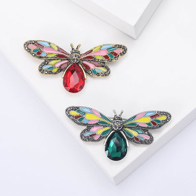 Multicolor Enamel Dragonfly Brooch With Teardrop Gem shown from the front on a white background