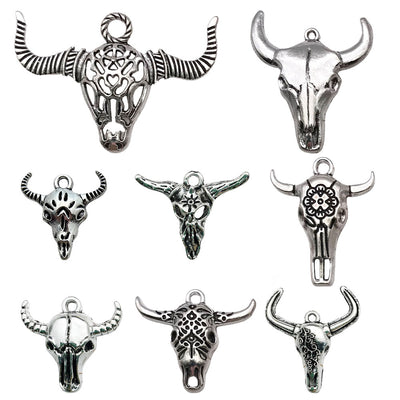 Metallic assorted shape charms arranged on a light background