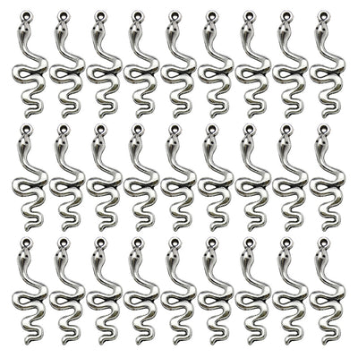 Antique silver assorted shape charms arranged on a light background