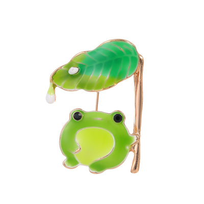 Front product view of the frog brooch pin in green and gold