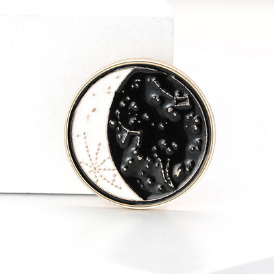 black celestial round brooch shown in the main product arrangement