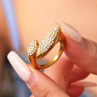 Fingers holding gold dual marquise pave zircon open ring