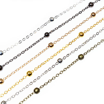 fine chain with evenly spaced round beads assortment on a light background