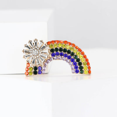 Front view of the rainbow crystal brooch with clear starburst accent brooch and its color options