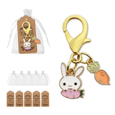 Packaging overview shows the white bunny egg and carrot clasp charm with an organza bag and kraft tags.