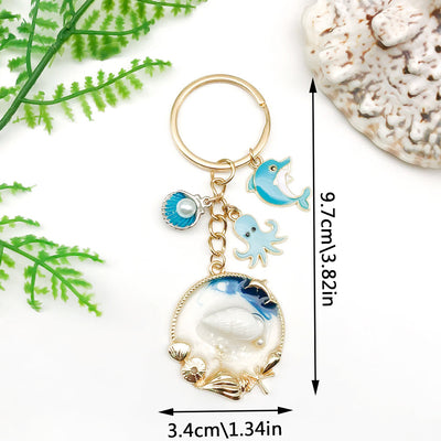 Main display of blue ocean dolphin octopus seahorse and shell keychains