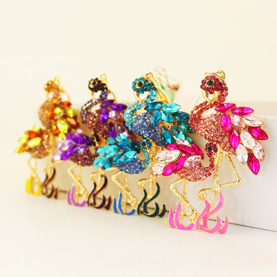 Four jeweled flamingo pair designs in pink, blue, purple, and amber tones.