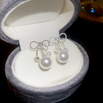 Silver Tone Crystal Bow Earrings with Round Pearl Drops